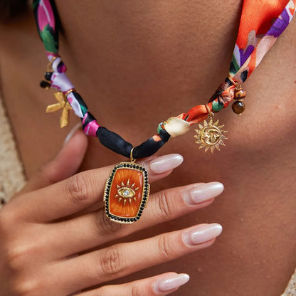 The Soleil Charm Scarf Necklace | Sun & Eye Medallion Accessory